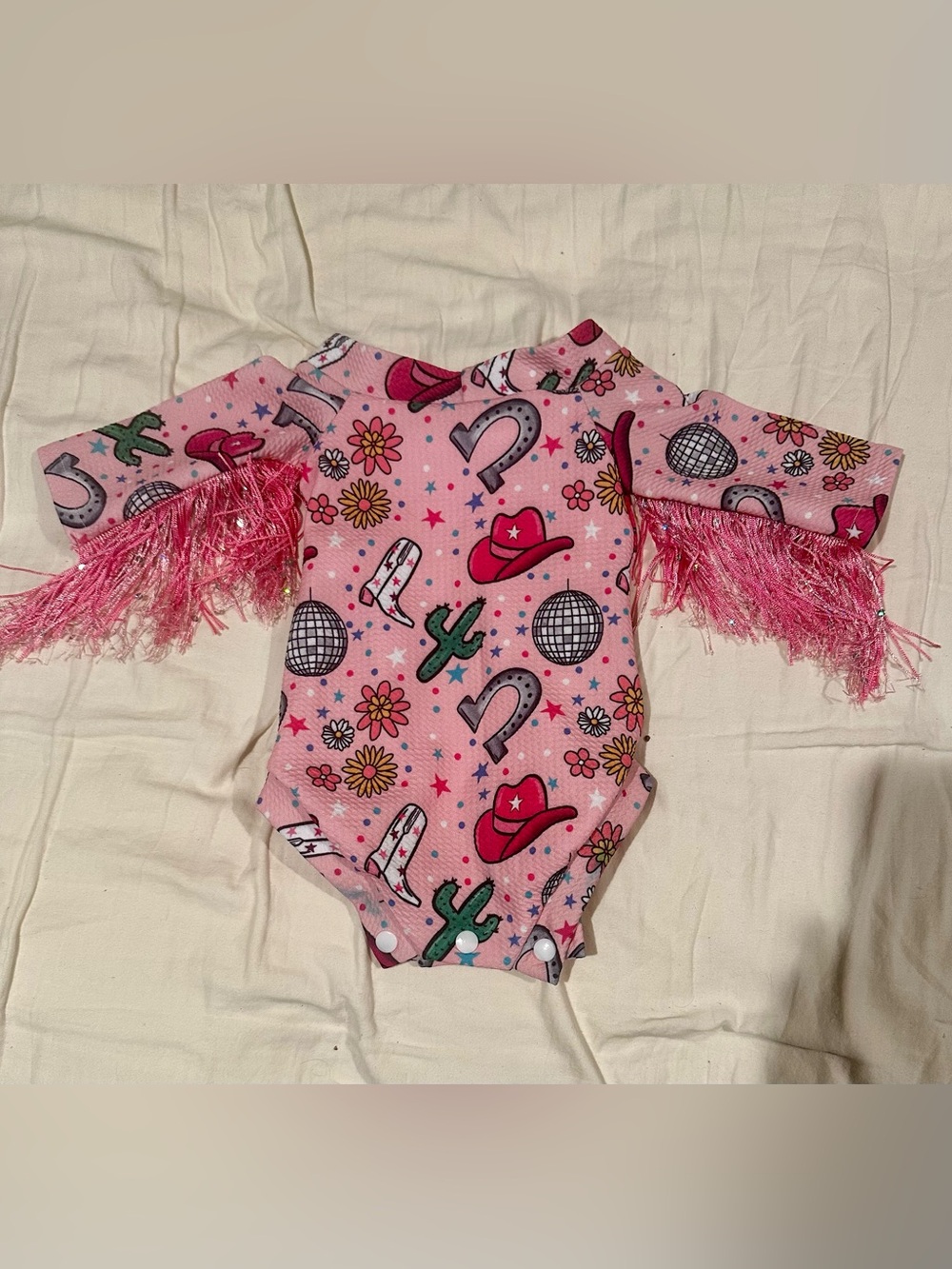 Pink cowboy disco baby onesie